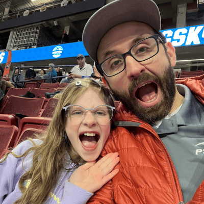 Nick Foster and his daughter watching the PSU’s women’s basketball team play in the Big Sky basketball tournament, in Boise, ID
