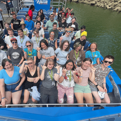 Students in the 2023 summer camp ride a jet boat in the Willamette River