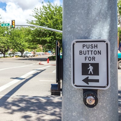 push button for crosswalk sign on a road in USA